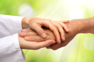 caregiver giving soup to elderly woman